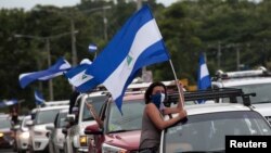 An anti-government protester takes part in a caravan of car and motorcycles to demand an end to violence in Ticuantepe, Nicaragua, July 15, 2018.