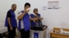 Officials work at a polling station during parliamentary elections in the Kurdistan region of Iraq, in Irbil, Oct. 20, 2024.