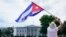 People participate in a rally outside the White House in Washington, Tuesday, July 13, 2021, in support of the protesters in Cuba. The problems of two tiny Caribbean states, Cuba and Haiti, have vexed U.S. presidents for decades. Now, Haiti and Cuba…