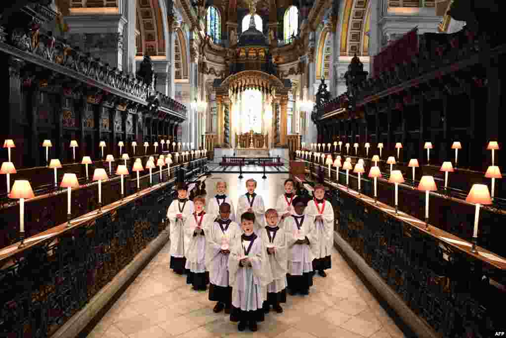 People sing as the St. Paul&#39;s Cathedral Choristers prepare for their first live-streamed Christmas event in London.