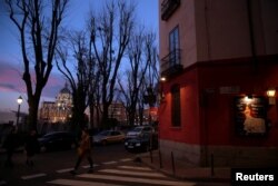 People walk past Corral de la Moreria, a flamenco venue in Madrid, Spain, Jan. 16, 2017.