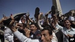 Yemeni anti-government demonstrators shout slogans during a demonstration demanding the resignation of President Ali Abdullah Saleh, in Sanaa, Yemen, February 20, 2011