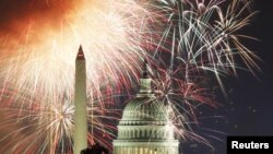 Fireworks light up the sky over the United States Capitol dome and the Washington Monument in Washington July 4, 2011 . (REUTERS/Hyungwon Kang)