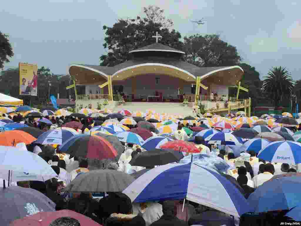 Kenyans gather under umbrellas during a Mass by Pope Francis at the University of Nairobi, in Kenya, Nov. 26, 2015. The pope is making his first trip to Africa.