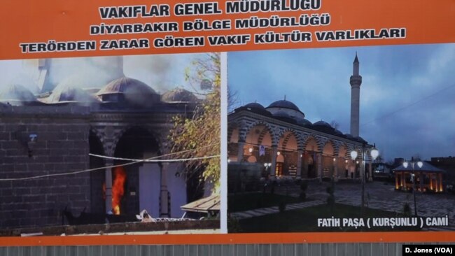 Posters by the AKP show the destruction caused by fighting with the PKK in Diyarbakir and how authorities are now rebuilding the city.