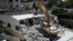 Israeli authorities demolish a Palestinian owned house in east Jerusalem, Aug. 21, 2019.