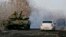 FILE: A pro-Russian separatists tank is seen on a road near the village of Rozsypne, eastern Ukraine, Dec. 15, 2014.