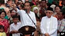 Presiden Joko Widodo didampingi KH Ma'ruf Amin dalam pidato pasca dinyatakan menang dalam Pilpres, di Jakarta Selasa (21/5). 