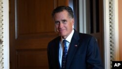 Sen. Mitt Romney, R-Utah, walks out of a Republican policy luncheon on Capitol Hill in Washington, Nov. 5, 2019.