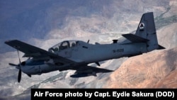 FILE - An A-29 Super Tucano aircraft flies over Afghanistan during a training mission, April 6, 2016. 
