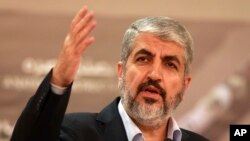 FILE - Khaled Mashaal, leader of the Palestinian Islamic militant movement Hamas that has governed Gaza since a 2007 takeover, delivers a speech in Doha, Qatar, Aug. 28, 2014.