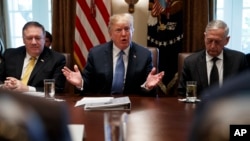 Secretary of State Mike Pompeo, left, and Secretary of Defense Jim Mattis, right, listen as President Donald Trump speaks during a Cabinet meeting at the White House, June 21, 2018, in Washington.
