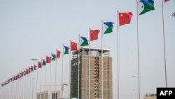 National flags of China and Djibouti fly in front of Djibouti International Free-Trade Zone before the inauguration ceremony in Djibouti, July 5, 2018.