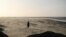 A person walks among the blows sand on St Annes beach in Lytham St Annes, near Blackpool, north-west England on Jan. 24, 2025, as storm Eowyn brings winds of 100 mph to the UK and Ireland. 