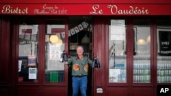 Bistro owner Pierre-Christophe Hantz in front of his restaurant, Le Vaudesir, in the French capital, Paris. (AP Photo/Francois Mori)