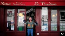 Bistro owner Pierre-Christophe Hantz in front of his restaurant, Le Vaudesir, in the French capital, Paris. (AP Photo/Francois Mori)