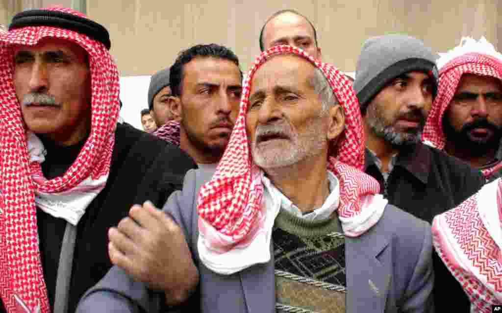 In Damascus, the father (center) of a Syrian general killed in the unrest, Jan. 17, 2012 (E. Arrott/VOA)