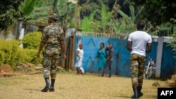 FILE - Soldiers patrol in Bafut, in the northwest English-speaking region of Cameroon, Nov. 15, 2017.