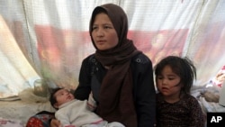 Fatima, an internally displaced Afghan woman who fled her home due to fighting between the Taliban and Afghan security personnel, speaks to the Associated Press at a camp on the outskirts of Mazar-e-Sharif, northern Afghanistan, July 8, 2021. 