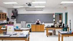 Pinon High School science teacher James Gustafson teaches virtually from his empty classroom in Pinon, Ariz., on Sept. 24, 2020. (Megan Marples/Cronkite News via AP)