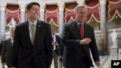 Speaker of the House Paul Ryan, R-Wis., left, and Majority Leader Kevin McCarthy, R-Calif., right, walk to the chamber where the House voted overwhelmingly to send a $15.3 billion disaster aid package to President Donald Trump, Sept. 8, 2017.