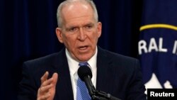 FILE - Director of the Central Intelligence Agency (CIA) John Brennan talks to the press during a rare news conference at CIA headquarters in Virginia, Dec. 11, 2014. 