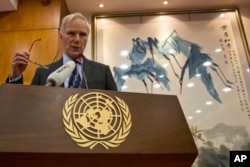 FILE - United Nations Special Rapporteur on extreme poverty and human rights, Philip Alston, speaks during a press conference in Beijing, China, Aug. 23, 2016.