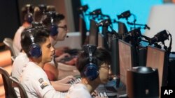 FILE - Philadelphia Fusion players compete against the London Spitfire during the Overwatch League Grand Finals at Barclays Center, Brooklyn, N.Y., July 28, 2018. The Overwatch League says Atlanta will join the global, city-based esports circuit for its second season in 2019.