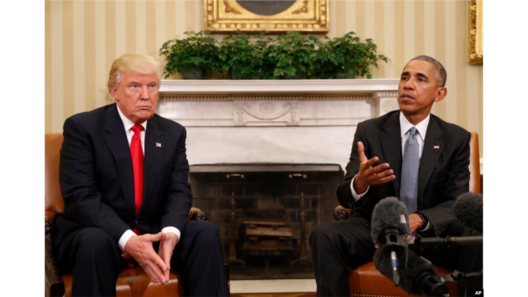 FILE - President Barack Obama meets with President-elect Donald Trump in the Oval Office of the White House.