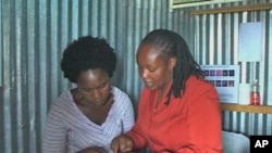 Peer educator Susan Mwangi explains the finer points of reproductive health, Kenya, April 26, 2011. 