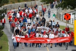 Supporters of Michael Kovrig and Michael Spavor march to mark 1,000 days since the Canadians were arrested in China, during a protest in Ottawa, Ontario, Canada September 5, 2021. REUTERS/Blair Gable