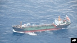 This May 19, 2018 photo released by Japan's Ministry of Defense shows North Korean-flagged tanker Ji Song 6 in the East China Sea. 