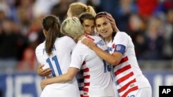 United States' Tobin Heath, second from right, is congratulated on her goal by Mallory Pugh (11), Megan Rapinoe and Alex Morgan (13) during the first half of a SheBelieves Cup soccer match against Brazil, March 5, 2019, in Tampa, Fla.