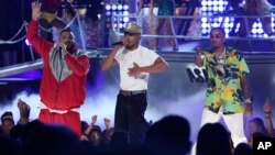 FILE - DJ Khaled, from left, Chance The Rapper, and Quavo perform "I'm the One" at the BET Awards at the Microsoft Theater, June 25, 2017, in Los Angeles.