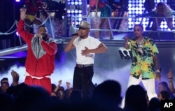DJ Khaled, from left, Chance The Rapper, and Quavo perform "I'm the One" at the BET Awards at the Microsoft Theater, June 25, 2017, in Los Angeles.