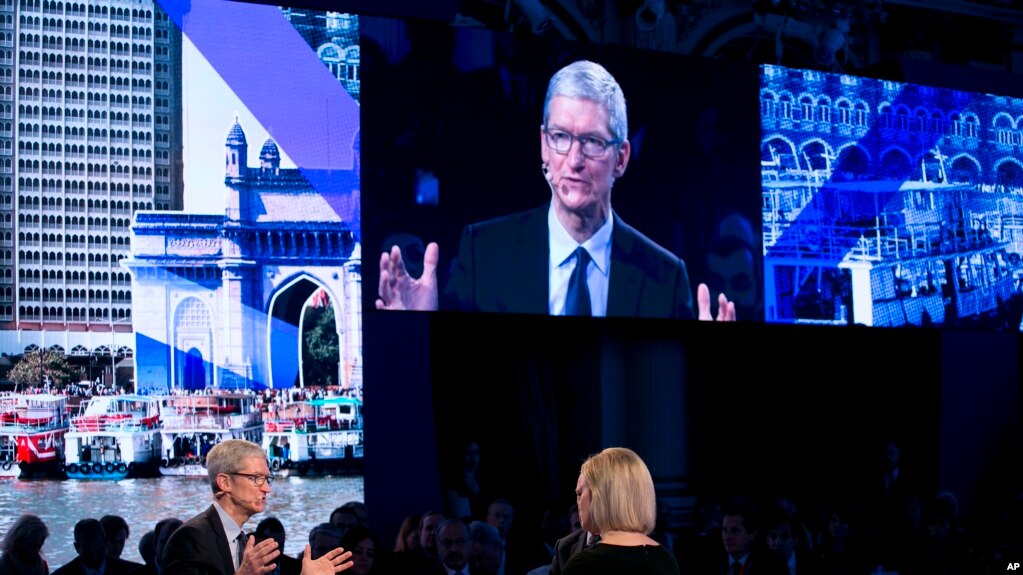 Apple CEO Tim Cook, lower left, speaks at the Bloomberg Global Business Forum, Sept. 20, 2017, in New York.