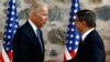 U.S. Vice President Joe Biden, left, shakes hands with Turkish Prime Minister Ahmet Davutoglu, right, following a joint news conference after their meeting in Dolmabahce Palace in Istanbul, Jan. 23, 2016.