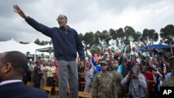 FILE - Rwanda's President Paul Kagame waves to the crowd before speaking at a baby gorilla naming ceremony in Kinigi, northern Rwanda, Sept. 5, 2015. Rwanda said Wednesday that it has signed a tourism promotion deal with the English soccer club Arsenal to highlight its "growing numbers of wildlife."