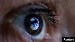 GRU, Russia's Main Intelligence Directorate logo is reflected in an eye in this picture illustration taken Oct. 4, 2018. 