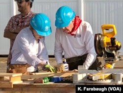 Former President Jimmy Carter and first lady Rosalyn Carter worked. “Nobody works harder than them, and they set an example for everybody, they really do,” Trisha Yearwood said, standing nearby as the Carters cut wood and assembled material that will eventually be a porch railing.