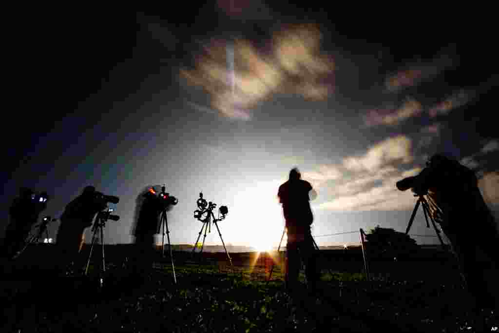 Photographers record the launch of the Falcon 9 SpaceX from Space Launch Complex 40 at the Cape Canaveral Air Force Station in Cape Canaveral, Fla., Saturday, Jan. 10, 2015.