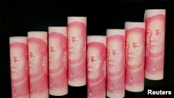 FILE - 100 Yuan notes are seen in this illustration picture in Beijing.