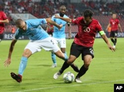 Albania's Jahmir Hyka, right, fights for the ball with Israel's Nisso Kapiloto during the UEFA Nations League soccer match between Albania and Israel at Elbasan Arena, in Albania, Sept. 7, 2018. Albania won the match 1-0.