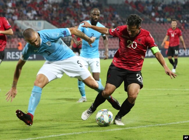 Albania's Jahmir Hyka, right, fights for the ball with Israel's Nisso Kapiloto during the UEFA Nations League soccer match between Albania and Israel at Elbasan Arena, in Albania, Sept. 7, 2018. Albania won the match 1-0.