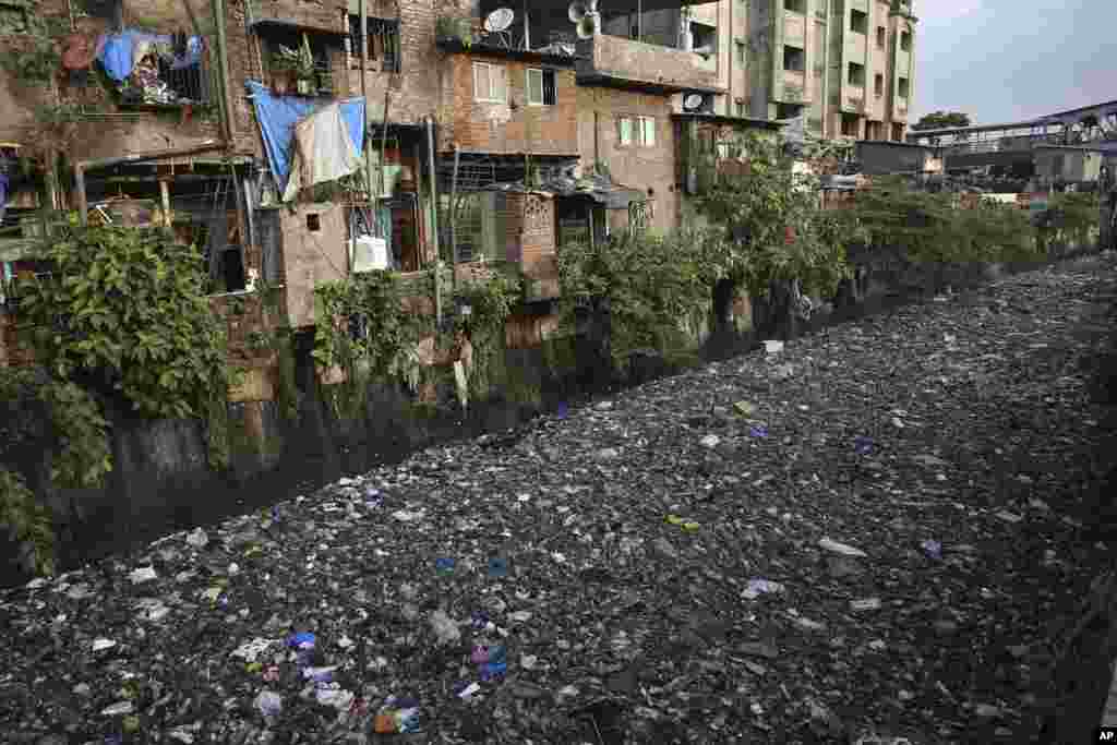 Garbage chokes a polluted canal in Mumbai, India. The theme for this year&#39;s World Environment Day, marked on June 5, is &quot;Beat Plastic Pollution.&quot;