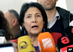 Salome Zurabishvili, former Georgian Foreign minister and presidential candidate, speaks to the media at a polling station during the presidential election at the polling station in Tbilisi, Georgia, Oct. 28, 2018.
