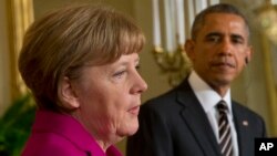 FILE - President Barack Obama and German Chancellor Angela Merkel participate in a joint news conference at the White House in Washington, Feb. 9, 2015. The two will confer on a variety of issues during Obama's two-day visit to Germany.