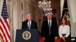 Judge Neil Gorsuch speaks as his wife Louise and President Donald Trump stand with him on stage in East Room of the White House in Washington, Tuesday, Jan. 31, 2017