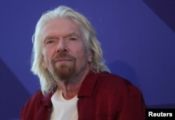 Richard Branson listens to a question at a press briefing in New York, Feb. 14, 2019.