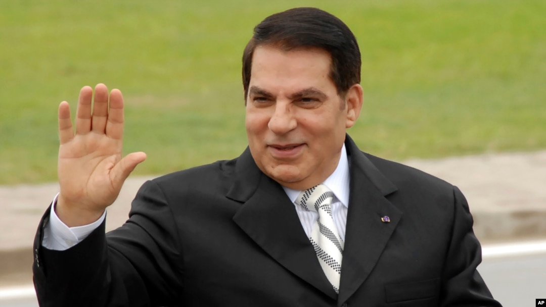 FILE - Then Tunisian President Zine El Abidine Ben Ali waves from his car as he arrives at campaign rally in Rades, outside Tunis, Oct.11, 2009.